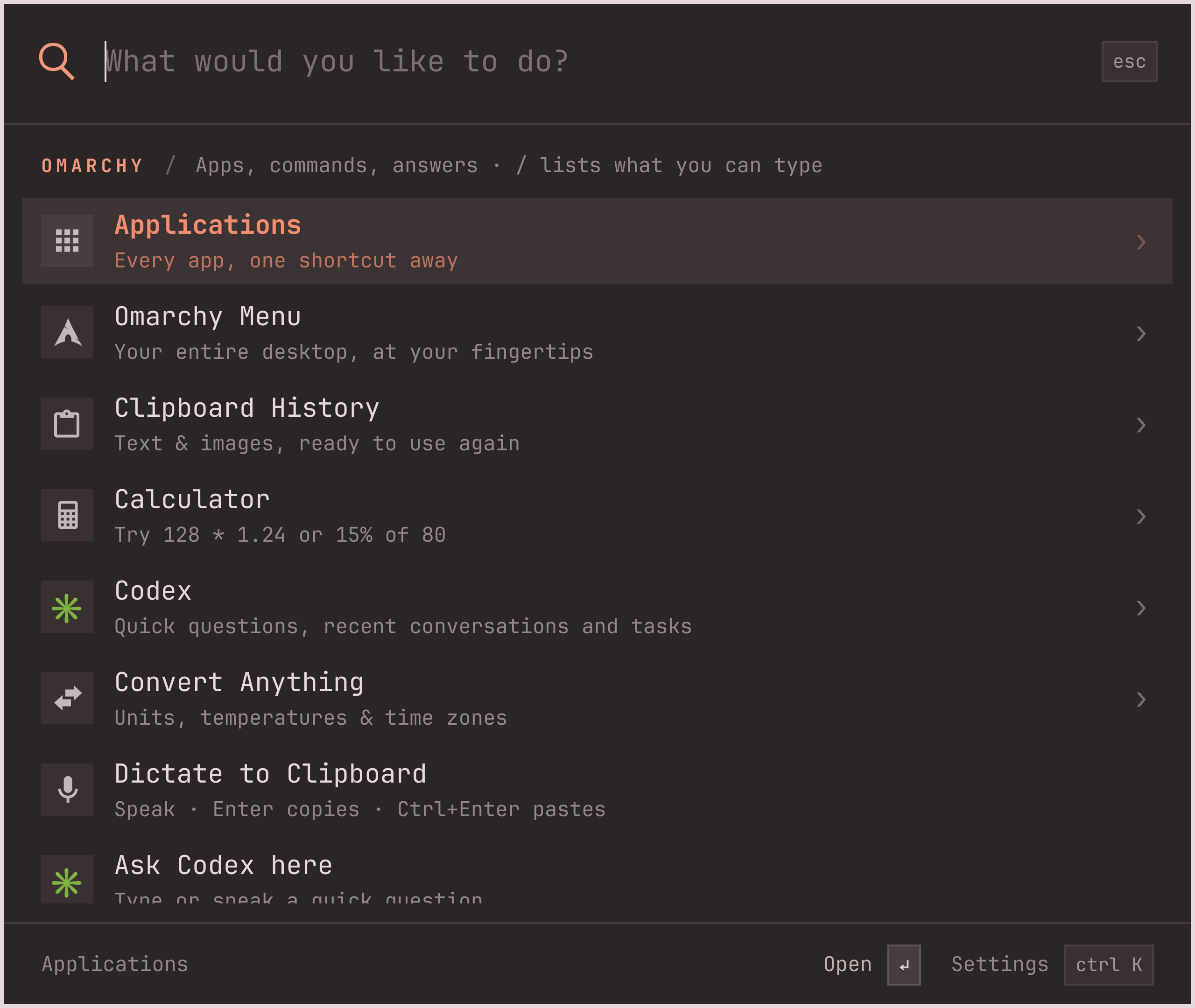 The empty palette listing Applications, Omarchy Menu, Clipboard History, Calculator, Convert Anything, Dictate to Clipboard and more